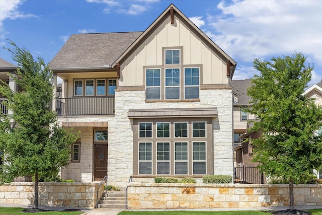 9650 Caddo Ridge Ln, Cypress, TX 77433 - view of front of home featuring stone siding, board and batten siding, and roof with shingles
