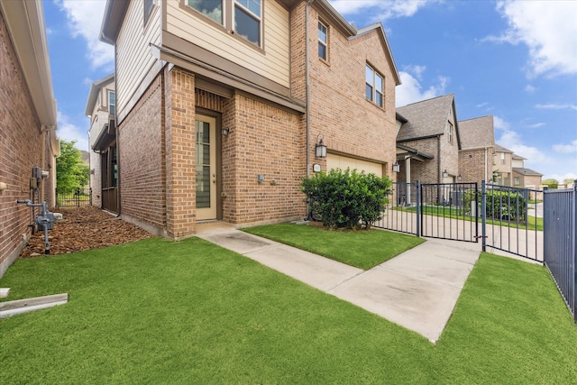 9650 Caddo Ridge Ln, Cypress, TX 77433 - view of home's exterior featuring brick siding, an attached garage, concrete driveway, a gate, and a residential view