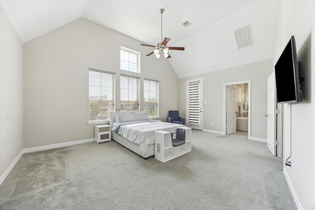 9650 Caddo Ridge Ln, Cypress, TX 77433 - bedroom featuring light carpet, baseboards, ceiling fan, high vaulted ceiling, and ensuite bath