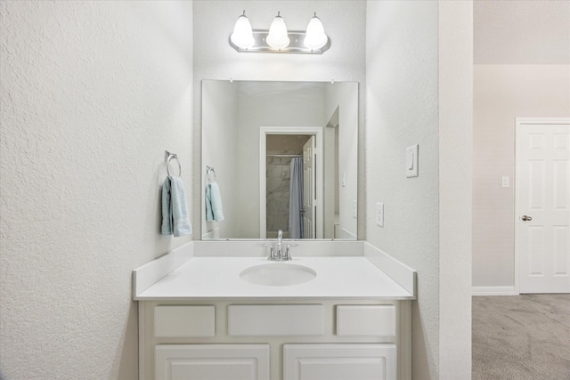 9650 Caddo Ridge Ln, Cypress, TX 77433 - full bath with a textured wall, vanity, and a shower with shower curtain