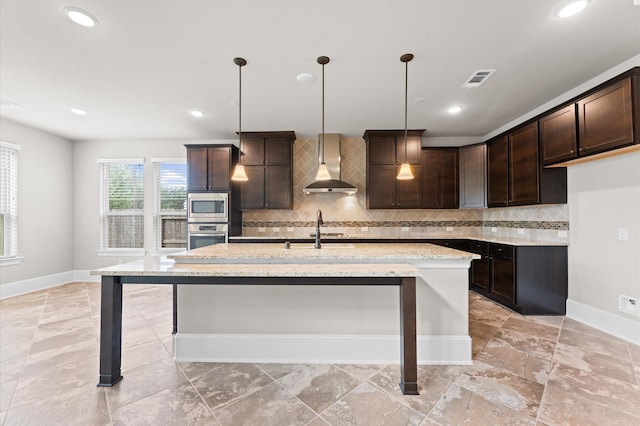 10115 Cypress Path, Missouri City, TX 77459 - kitchen featuring wall chimney range hood, appliances with stainless steel finishes, a sink, baseboards, and dark brown cabinets