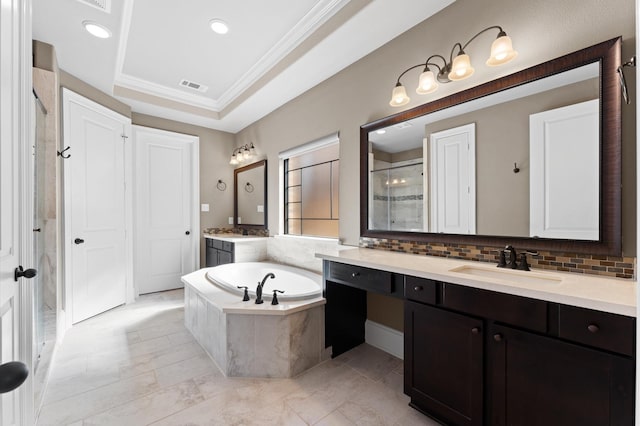 10115 Cypress Path, Missouri City, TX 77459 - full bath featuring a stall shower, crown molding, two vanities, a garden tub, and tasteful backsplash