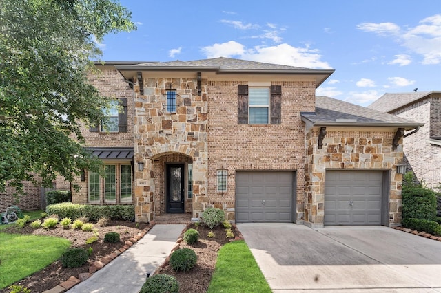 10115 Cypress Path, Missouri City, TX 77459 - view of front facade with concrete driveway, stone siding, and brick siding