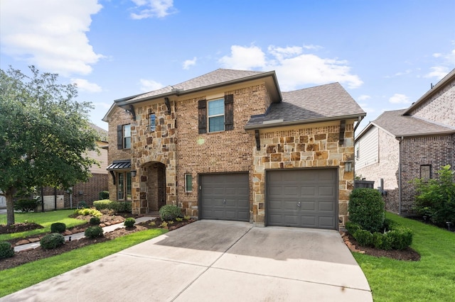 10115 Cypress Path, Missouri City, TX 77459 - view of front of home featuring driveway, stone siding, a front yard, a garage, and a shingled roof