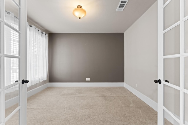 10115 Cypress Path, Missouri City, TX 77459 - carpeted empty room with french doors and baseboards