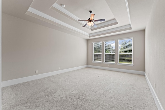 10115 Cypress Path, Missouri City, TX 77459 - spare room with a raised ceiling, light colored carpet, a ceiling fan, crown molding, and baseboards
