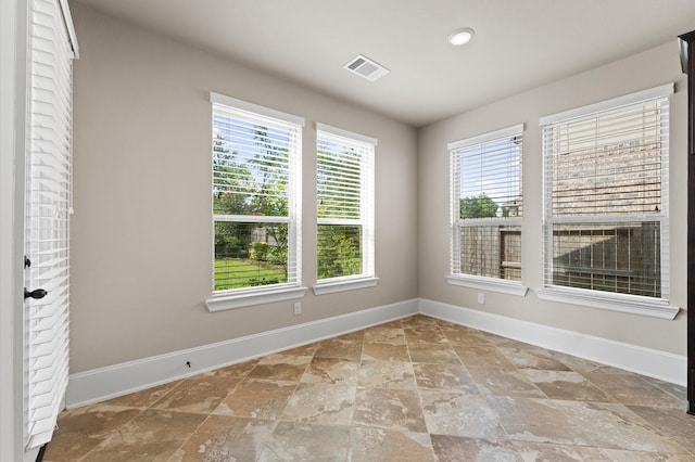 10115 Cypress Path, Missouri City, TX 77459 - empty room featuring baseboards and stone finish flooring