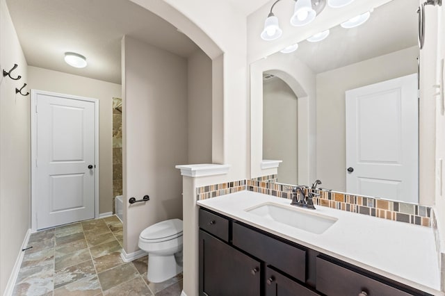 10115 Cypress Path, Missouri City, TX 77459 - full bathroom with baseboards, stone finish flooring, toilet, and vanity