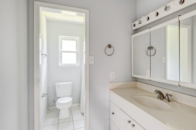 3826 Brier Gardens Dr, Houston, TX 77082 - bathroom featuring vanity, tile patterned floors, toilet, and baseboards