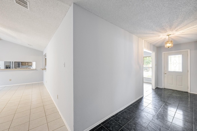 3826 Brier Gardens Dr, Houston, TX 77082 - tiled foyer entrance with a textured ceiling, baseboards, and vaulted ceiling