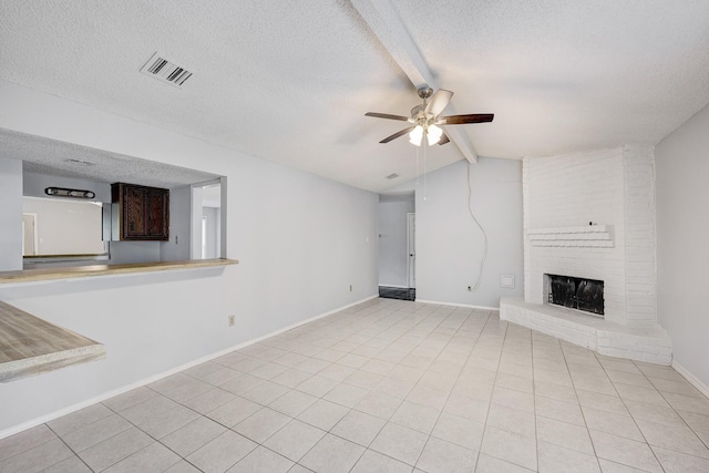 3826 Brier Gardens Dr, Houston, TX 77082 - unfurnished living room with ceiling fan, a textured ceiling, light tile patterned floors, a fireplace, and baseboards