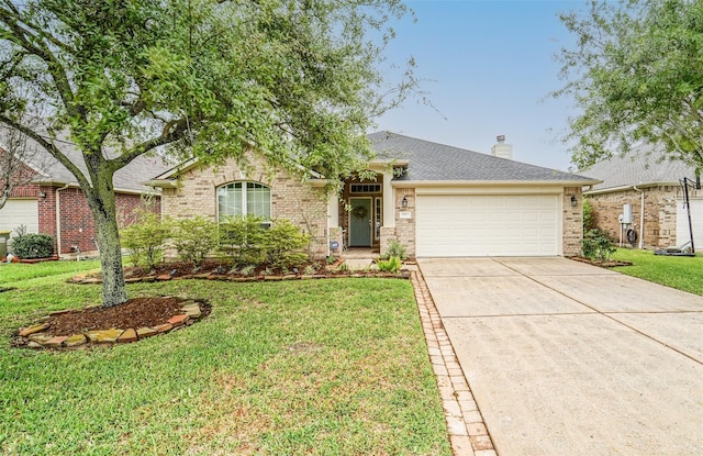 2957 Water Willow Ln, Pearland, TX 77581 - single story home with brick siding, an attached garage, concrete driveway, and a front lawn