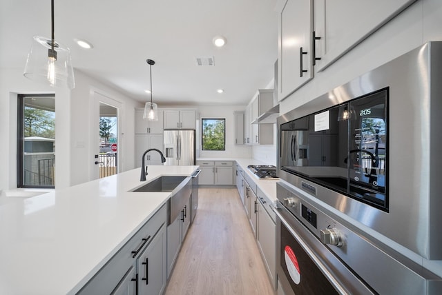 403 Forest Reserve Pl, Houston, TX 77079 - kitchen with a sink, appliances with stainless steel finishes, light wood-style floors, healthy amount of natural light, and recessed lighting