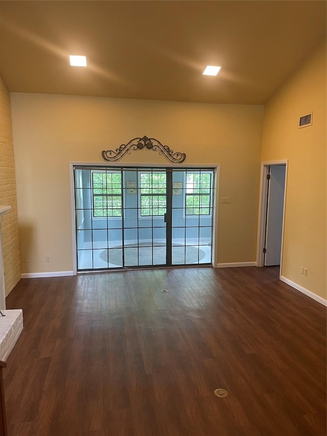 325 E Main St, Brenham, TX 77833 - unfurnished living room with dark wood finished floors and a fireplace