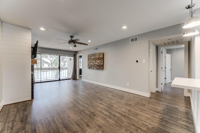 12100 Melville Dr Unit 606, Montgomery, TX 77356 - unfurnished living room with dark wood-style flooring, a ceiling fan, baseboards, and recessed lighting