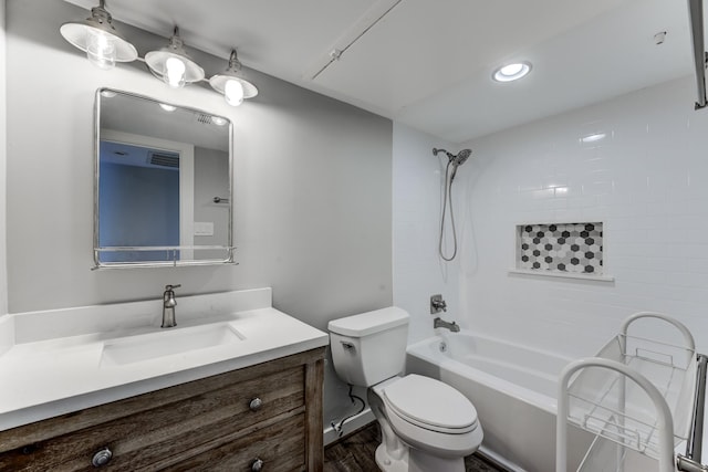 12100 Melville Dr Unit 606, Montgomery, TX 77356 - bathroom featuring vanity, bathing tub / shower combination, toilet, and wood finished floors
