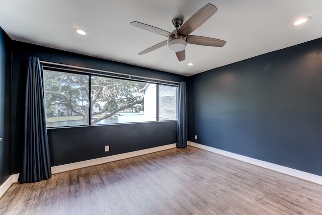12100 Melville Dr Unit 606, Montgomery, TX 77356 - empty room featuring ceiling fan, wood finished floors, baseboards, and recessed lighting