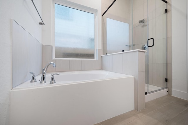 17055 Lilac Paxton Ln, Hockley, TX 77447 - bathroom with a garden tub, a shower stall, and tile patterned flooring