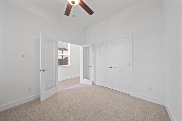 17055 Lilac Paxton Ln, Hockley, TX 77447 - unfurnished bedroom with light colored carpet, baseboards, and a ceiling fan