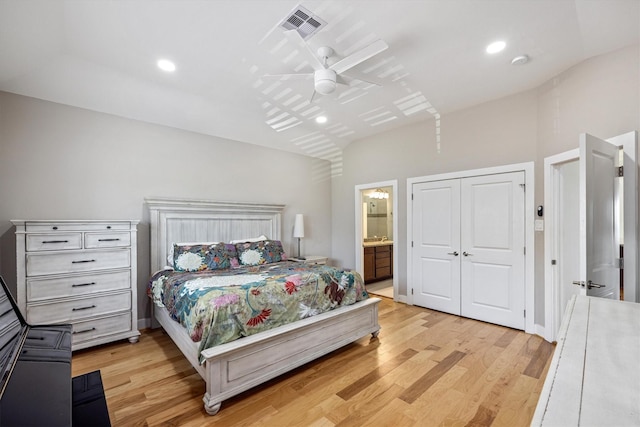 2811 Izamal Ct, Galveston, TX 77554 - bedroom featuring light wood-type flooring, vaulted ceiling, a ceiling fan, ensuite bathroom, and recessed lighting