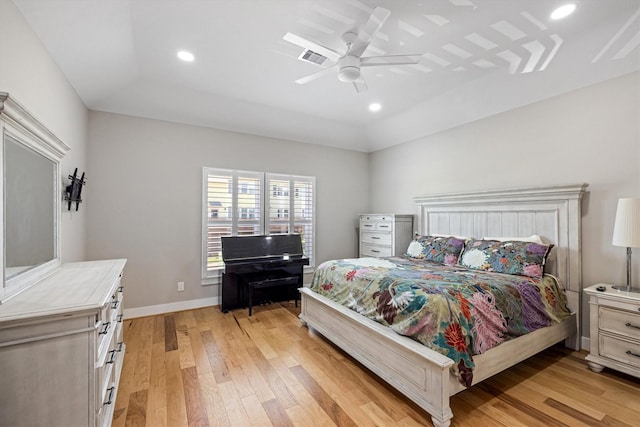 2811 Izamal Ct, Galveston, TX 77554 - bedroom featuring light wood finished floors, recessed lighting, a ceiling fan, baseboards, and a raised ceiling