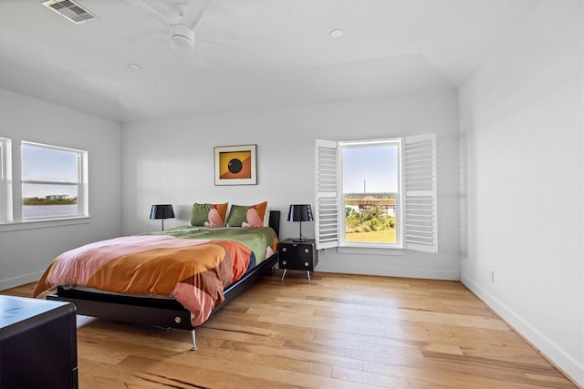 2811 Izamal Ct, Galveston, TX 77554 - bedroom with light wood finished floors, baseboards, and a ceiling fan