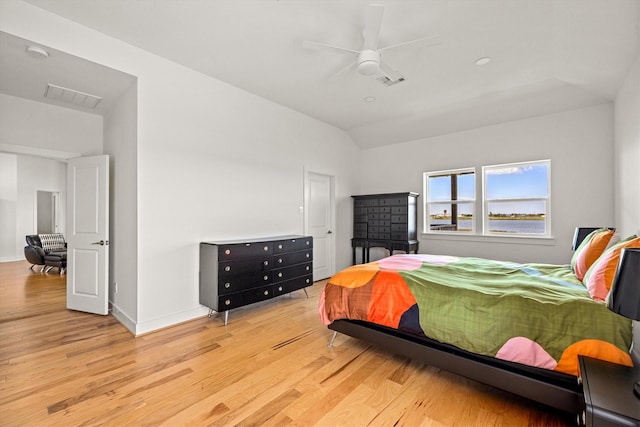 2811 Izamal Ct, Galveston, TX 77554 - bedroom with light wood finished floors, baseboards, ceiling fan, and lofted ceiling