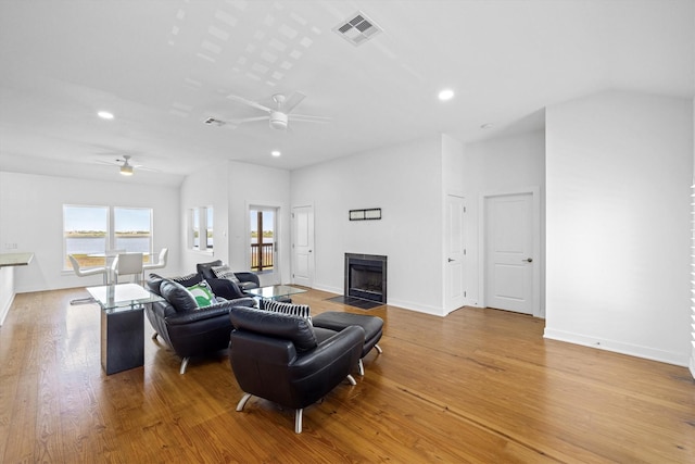2811 Izamal Ct, Galveston, TX 77554 - living area featuring ceiling fan, recessed lighting, light wood finished floors, a fireplace with flush hearth, and baseboards