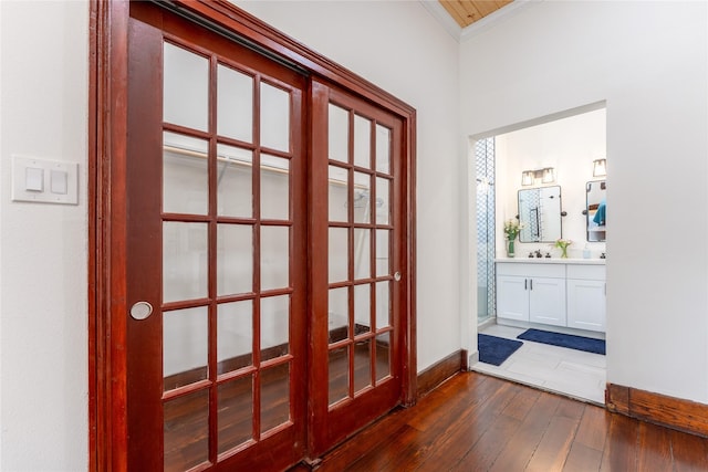 1828 Ursuline St, Galveston, TX 77550 - doorway with ornamental molding, dark wood-style flooring, french doors, and baseboards
