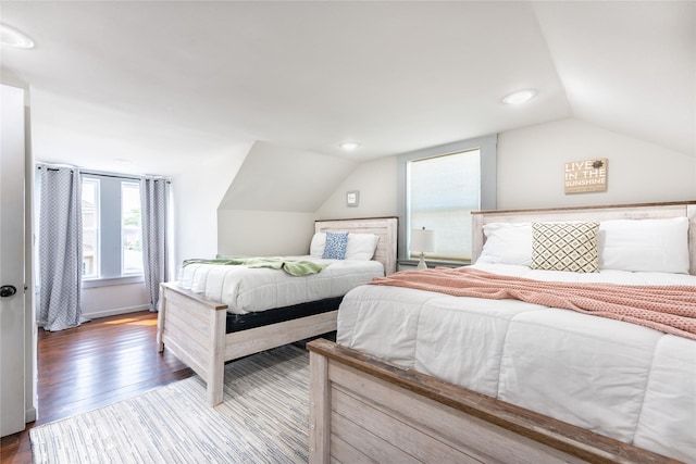 1828 Ursuline St, Galveston, TX 77550 - bedroom featuring lofted ceiling, multiple windows, wood finished floors, and recessed lighting