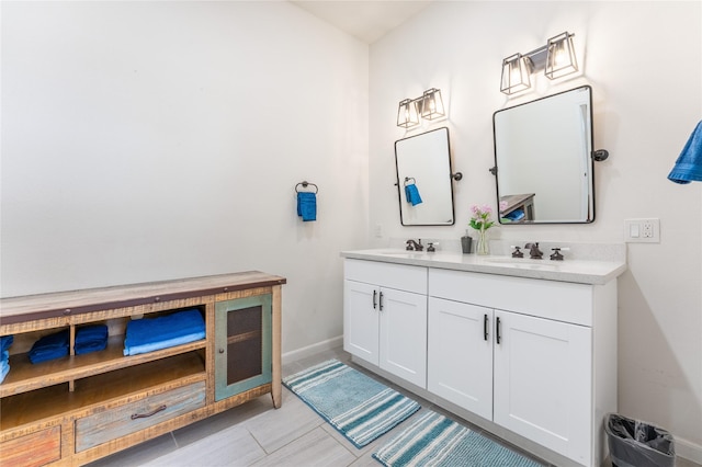 1828 Ursuline St, Galveston, TX 77550 - full bathroom with double vanity, baseboards, and tile patterned flooring