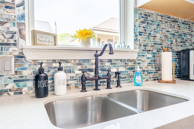 1828 Ursuline St, Galveston, TX 77550 - kitchen view of a sink, tasteful backsplash, and light stone countertops
