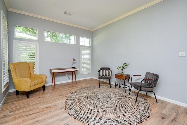 15603 Clear Pointe Dr, Cypress, TX 77429 - sitting room with light wood-style floors, ornamental molding, and baseboards