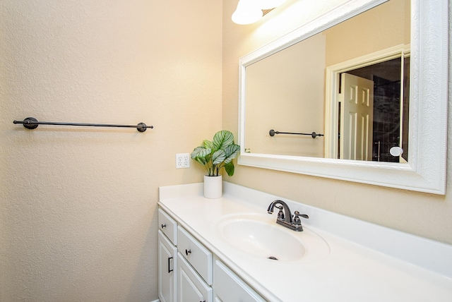 15603 Clear Pointe Dr, Cypress, TX 77429 - bathroom with vanity and a textured wall