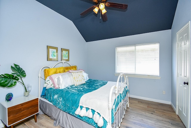 15603 Clear Pointe Dr, Cypress, TX 77429 - bedroom featuring vaulted ceiling, wood finished floors, baseboards, a closet, and ceiling fan