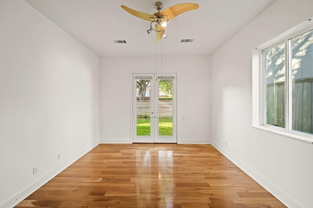 3810 Bellefontaine St, Houston, TX 77025 - unfurnished room with healthy amount of natural light, ceiling fan, light wood-style flooring, and baseboards