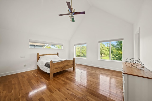 3810 Bellefontaine St, Houston, TX 77025 - bedroom featuring high vaulted ceiling, hardwood / wood-style flooring, baseboards, and a ceiling fan