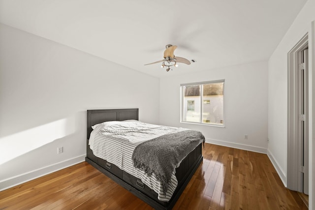 3810 Bellefontaine St, Houston, TX 77025 - bedroom featuring baseboards, wood-type flooring, and a ceiling fan