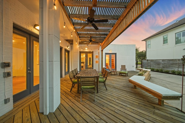 3810 Bellefontaine St, Houston, TX 77025 - deck at dusk featuring a ceiling fan, french doors, outdoor dining space, and a pergola