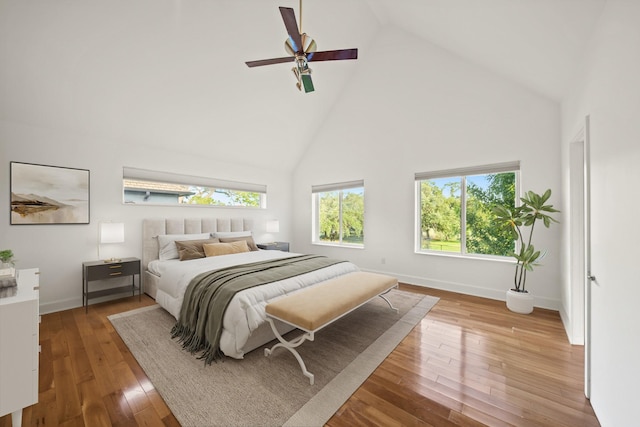 3810 Bellefontaine St, Houston, TX 77025 - bedroom with high vaulted ceiling, wood-type flooring, and ceiling fan