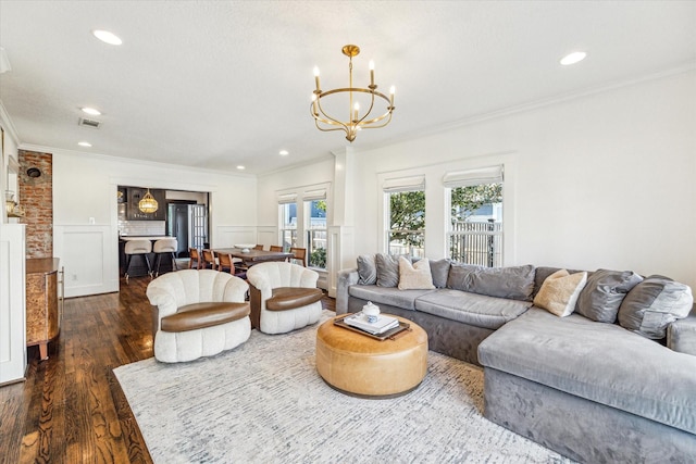 2229 Singleton St, Houston, TX 77008 - living room with dark wood finished floors, crown molding, a chandelier, recessed lighting, and a decorative wall