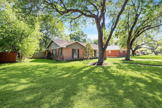 5227 Willowbend Blvd, Houston, TX 77096 - view of front facade featuring brick siding, board and batten siding, and roof with shingles