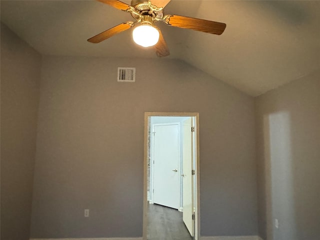 7340 Muffin Dr, Austin, TX 78724 - unfurnished room with baseboards, ceiling fan, vaulted ceiling, and wood finished floors