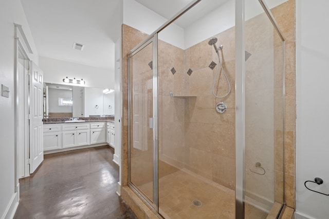 1226 Peden St, Houston, TX 77006 - bathroom featuring vanity, a shower stall, and finished concrete flooring