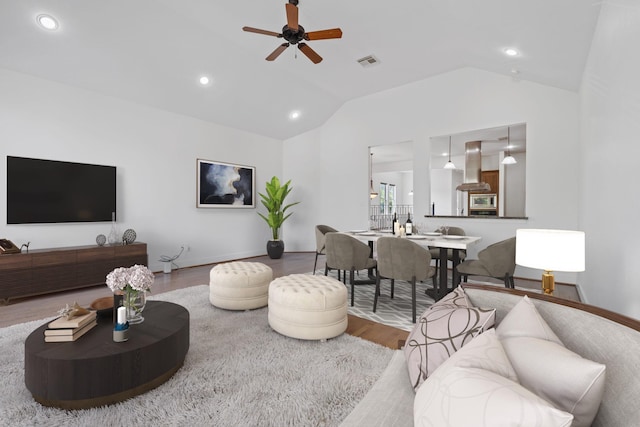 1226 Peden St, Houston, TX 77006 - living area with vaulted ceiling, wood finished floors, a ceiling fan, recessed lighting, and baseboards