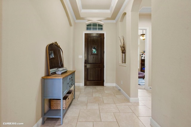 1522 Richland Hollow Ln, Friendswood, TX 77546 - foyer featuring ornamental molding, a raised ceiling, and arched walkways