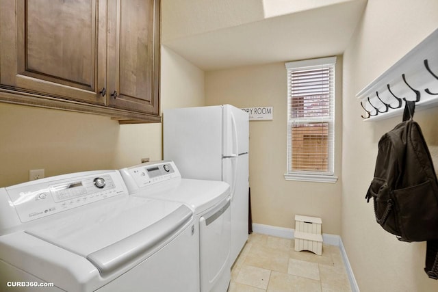 1522 Richland Hollow Ln, Friendswood, TX 77546 - washroom with cabinet space, independent washer and dryer, and baseboards