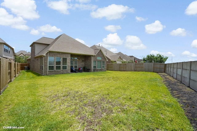 1522 Richland Hollow Ln, Friendswood, TX 77546 - rear view of house with brick siding and roof with shingles