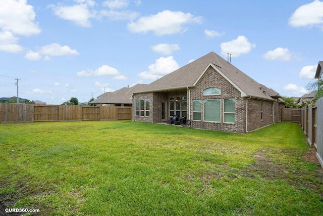 1522 Richland Hollow Ln, Friendswood, TX 77546 - rear view of house with brick siding and roof with shingles