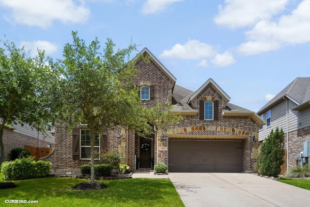 1522 Richland Hollow Ln, Friendswood, TX 77546 - view of front of house with brick siding, concrete driveway, a front lawn, and a garage